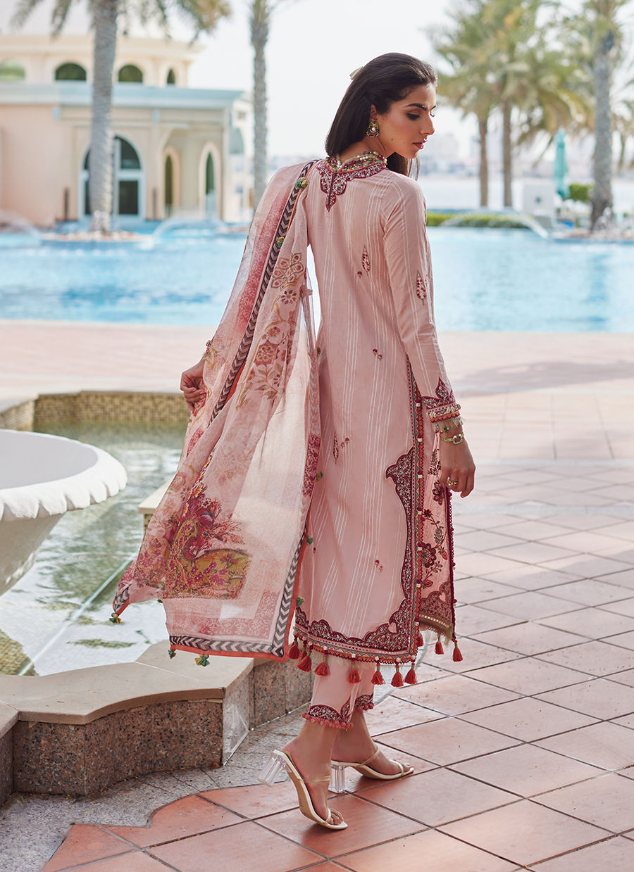 Model wearing tea pink embroidered dress with tassel detailing from Farah Talib Aziz Pricsilla, Pakistani Luxury pret in UK.