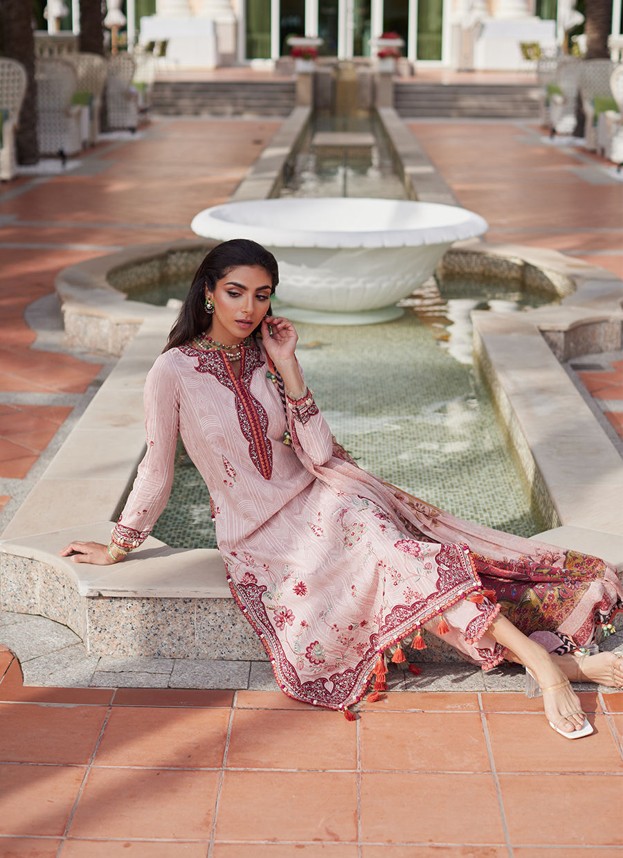 Model wearing tea pink embroidered dress with tassel detailing from Farah Talib Aziz Pricsilla, Pakistani Luxury pret in UK.