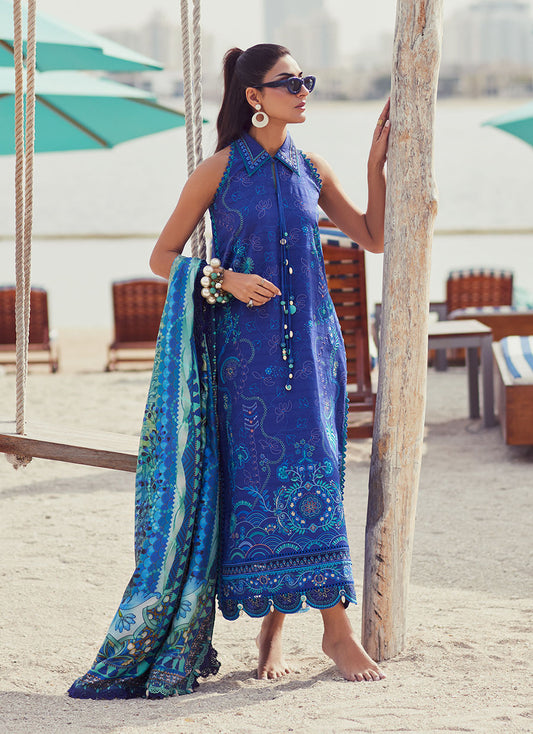 Model wearing a deep blue embroidered outfit from Farah Talib Aziz, Unstitched Luxury '25, ideal for Pakistani luxury pret lovers in UK.
