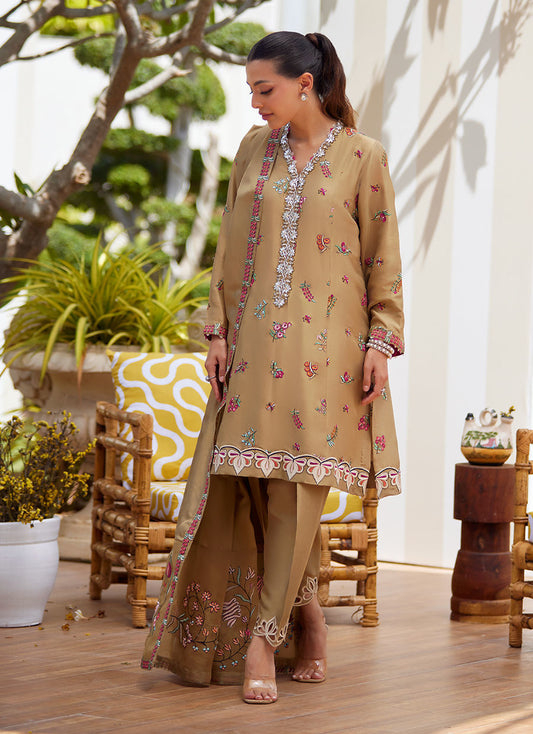 Model wearing beige embroidered dress with dupatta from Farah Talib Aziz, perfect for Pakistani luxury pret and Eid outfits in the UK.
