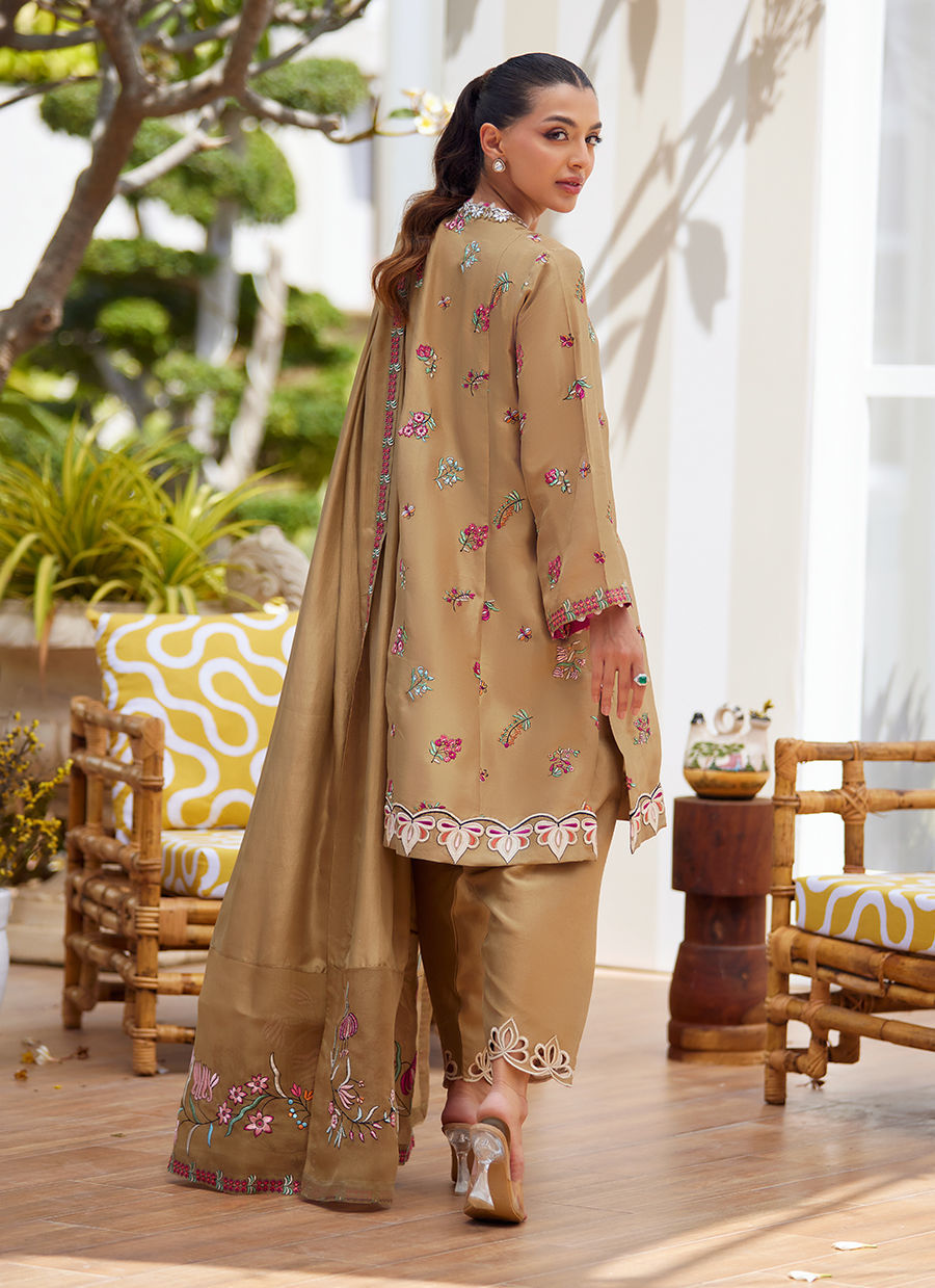 Model wearing beige embroidered dress with dupatta from Farah Talib Aziz, perfect for Pakistani luxury pret and Eid outfits in the UK.