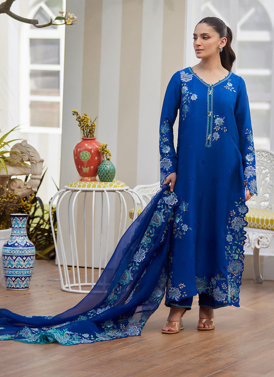 Model wearing cobalt blue embroidered dress with floral detailing from Farah Talib Aziz, ideal for Pakistani luxury pret online in UK.