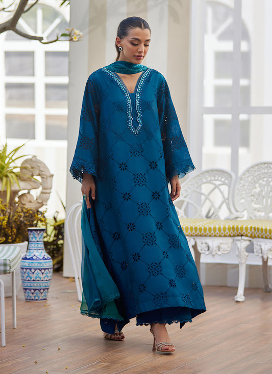 Model wearing teal blue embroidered dress with mirror detailing from Farah Talib Aziz, perfect for Pakistani luxury pret online in UK.