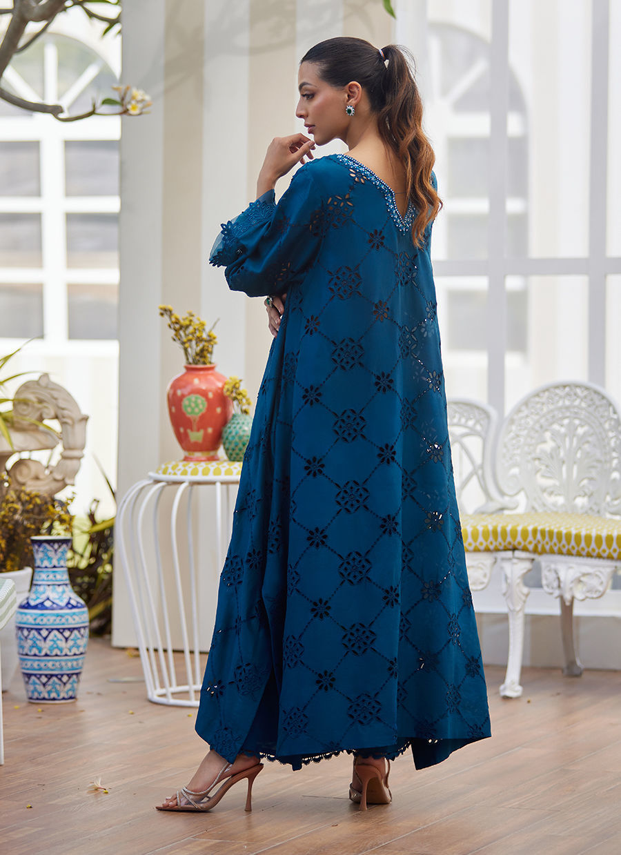 Model wearing teal blue embroidered dress with mirror detailing from Farah Talib Aziz, perfect for Pakistani luxury pret online in UK.