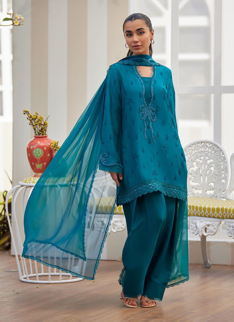 Model wearing emerald green embroidered outfit from Farah Talib Aziz, ideal for Pakistani luxury pret and Pakistani clothes online in UK.