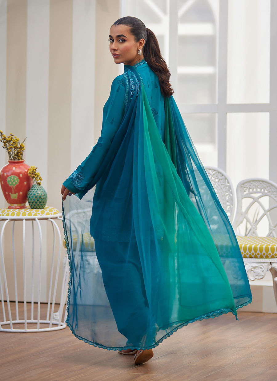 Model wearing emerald green embroidered outfit from Farah Talib Aziz, ideal for Pakistani luxury pret and Pakistani clothes online in UK.