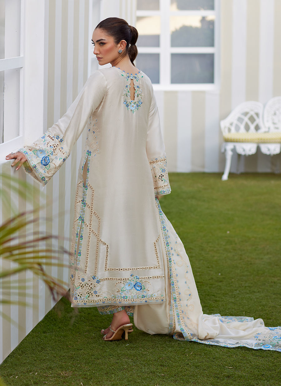 Model wearing ivory Delina outfit from Farah Talib Aziz, ideal for Pakistani luxury pret and Pakistani clothes online in UK.