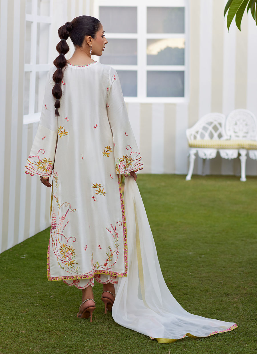 Model wearing ivory Mireza outfit from Farah Talib Aziz, featuring pastel embroidery, perfect for Pakistani luxury pret and clothes online in UK.