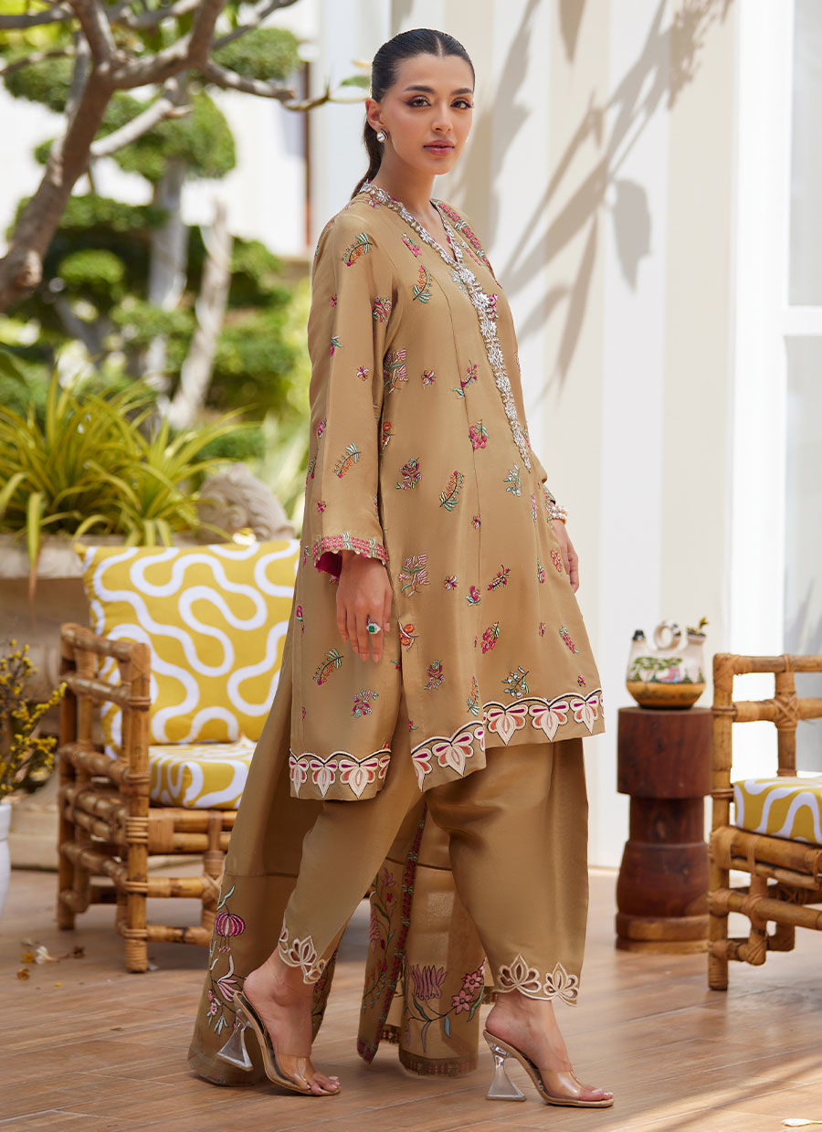 Model wearing beige embroidered dress with dupatta from Farah Talib Aziz, perfect for Pakistani luxury pret and Eid outfits in the UK.