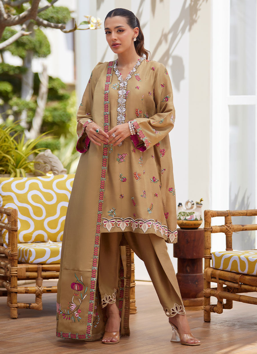 Model wearing beige embroidered dress with dupatta from Farah Talib Aziz, perfect for Pakistani luxury pret and Eid outfits in the UK.