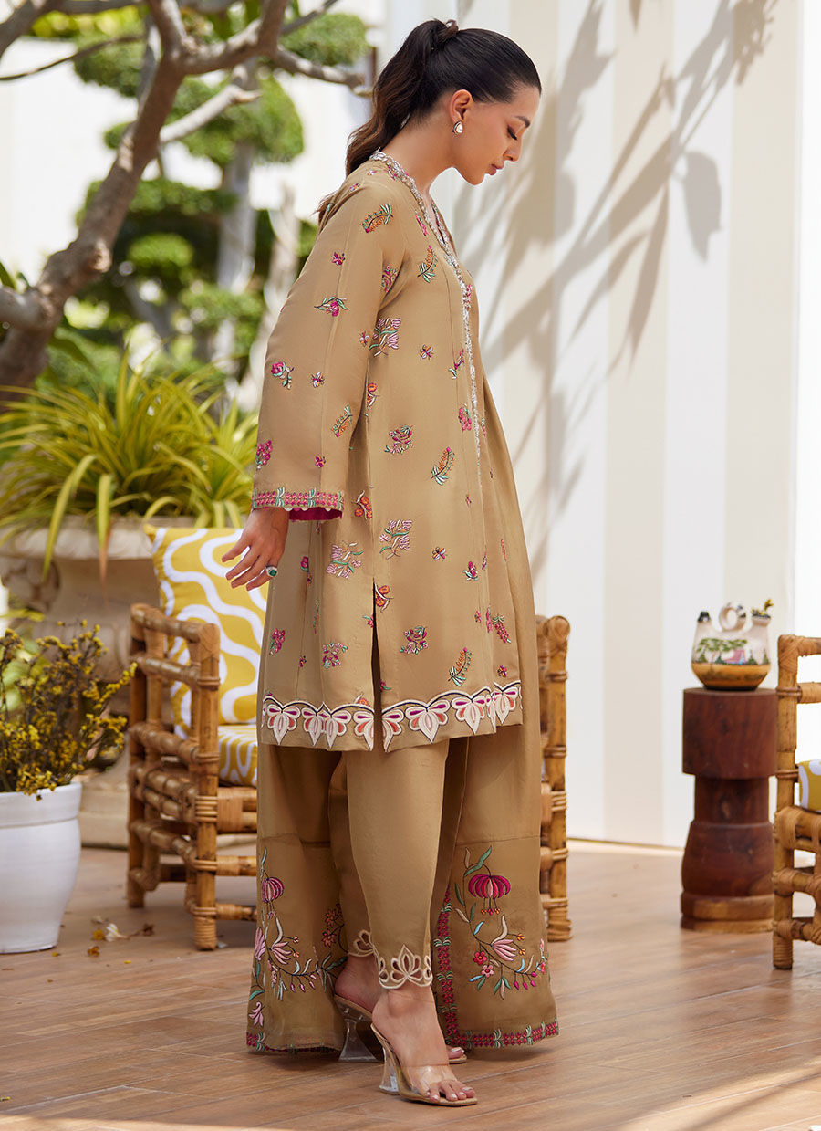 Model wearing beige embroidered dress with dupatta from Farah Talib Aziz, perfect for Pakistani luxury pret and Eid outfits in the UK.