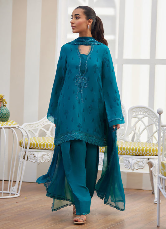 Model wearing emerald green embroidered outfit from Farah Talib Aziz, ideal for Pakistani luxury pret and Pakistani clothes online in UK.