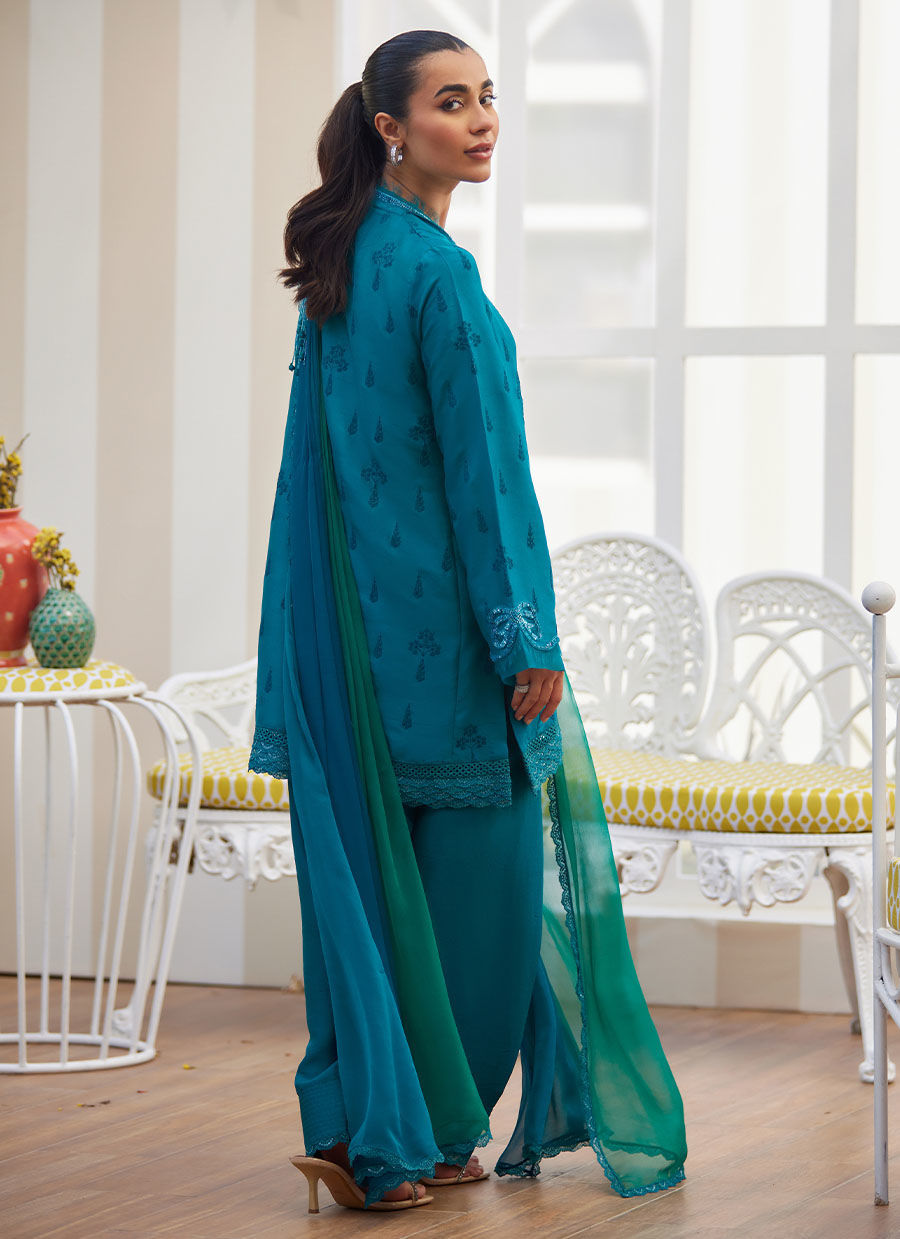 Model wearing emerald green embroidered outfit from Farah Talib Aziz, ideal for Pakistani luxury pret and Pakistani clothes online in UK.