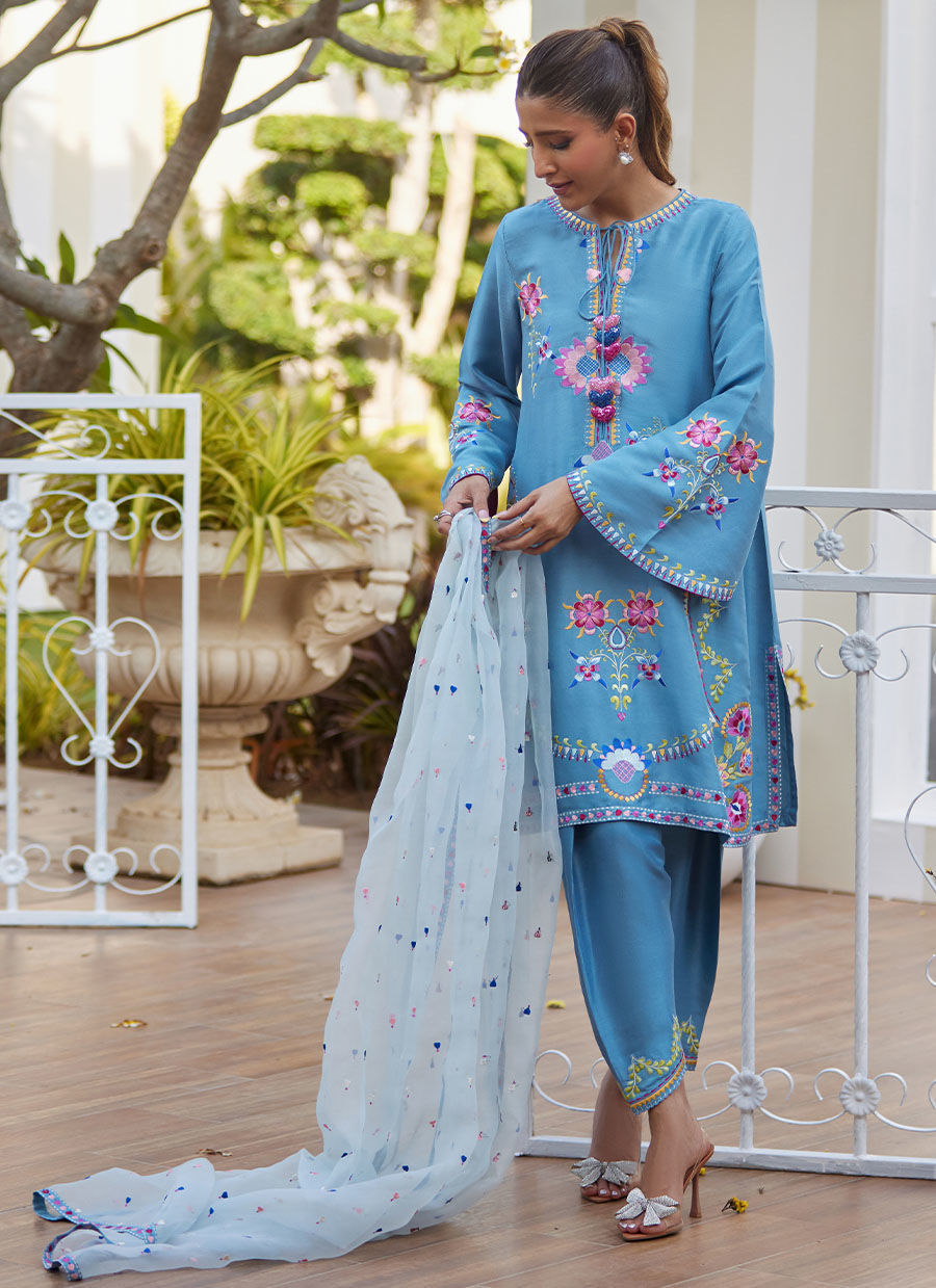 Model wearing sky blue embroidered outfit from Farah Talib Aziz, perfect for Pakistani luxury pret and Pakistani clothes online in UK.