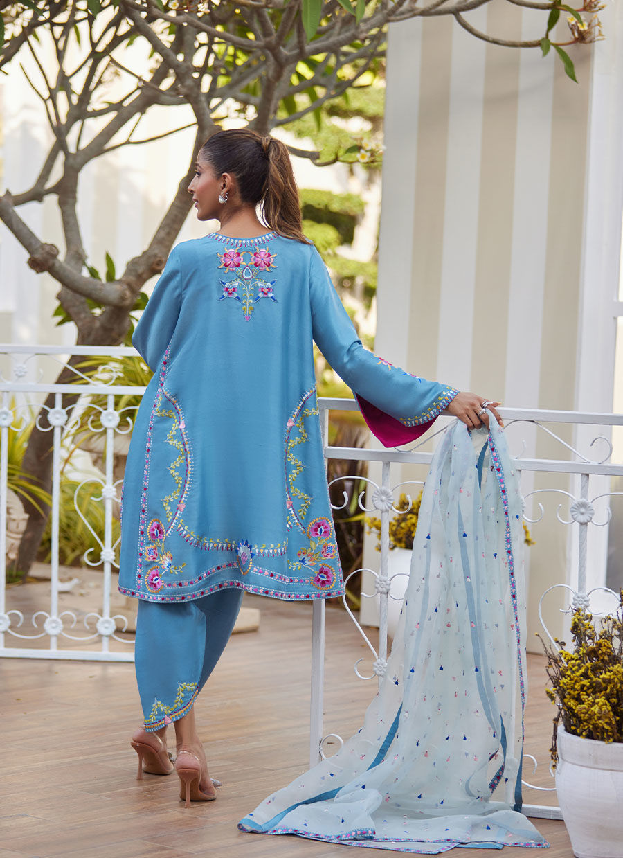 Model wearing sky blue embroidered outfit from Farah Talib Aziz, perfect for Pakistani luxury pret and Pakistani clothes online in UK.