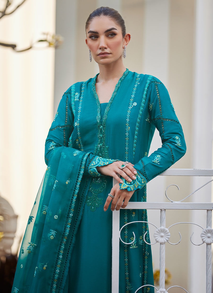Model wearing emerald green embroidered outfit from Farah Talib Aziz, ideal for Pakistani luxury pret and Pakistani clothes online in UK.