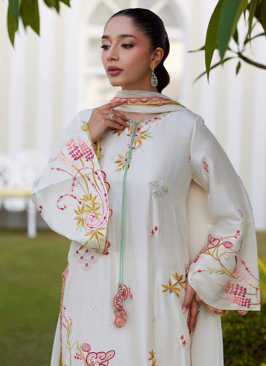 Model wearing ivory Mireza outfit from Farah Talib Aziz, featuring pastel embroidery, perfect for Pakistani luxury pret and clothes online in UK.