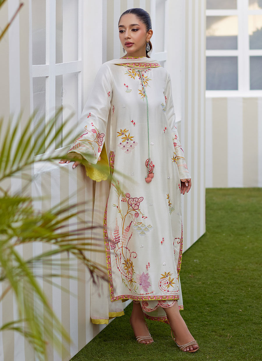 Model wearing ivory Mireza outfit from Farah Talib Aziz, featuring pastel embroidery, perfect for Pakistani luxury pret and clothes online in UK.