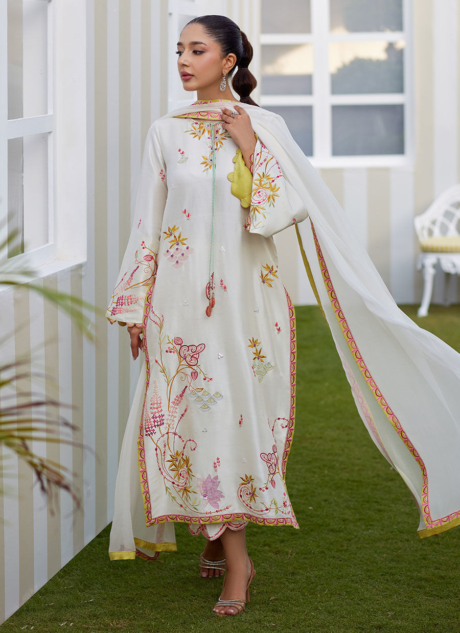 Model wearing ivory Mireza outfit from Farah Talib Aziz, featuring pastel embroidery, perfect for Pakistani luxury pret and clothes online in UK.
