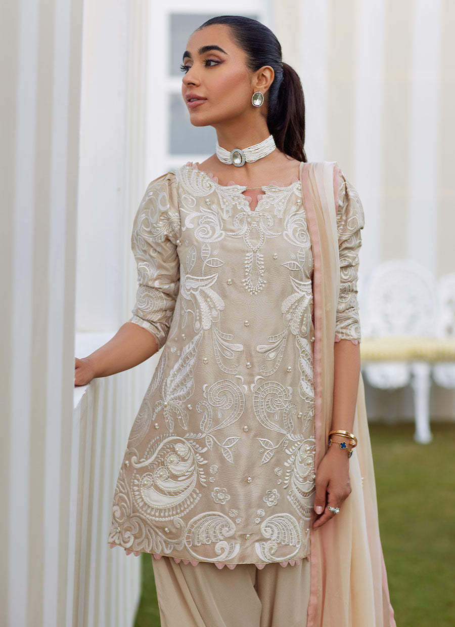 Model wearing sand Danika dress from Farah Talib Aziz, perfect for Pakistani luxury pret and Pakistani clothes online in UK.