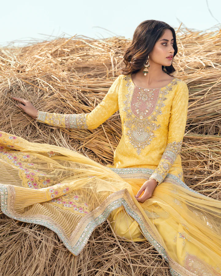 model wearing yellow dress by Faiza Saqlain, Pakistani luxury pret ideal for online shopping in the UK