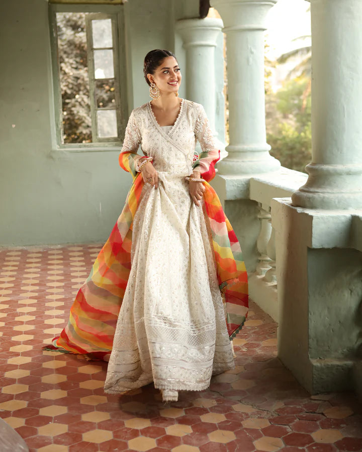 model wearing white dress with colorful dupatta by Faiza Saqlain, Pakistani luxury pret available online in UK