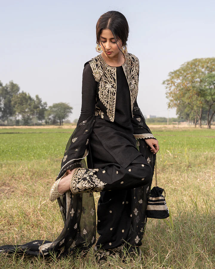 model wearing black dress by Faiza Saqlain, Pakistani luxury pret available online in UK for elegant Pakistani fashion