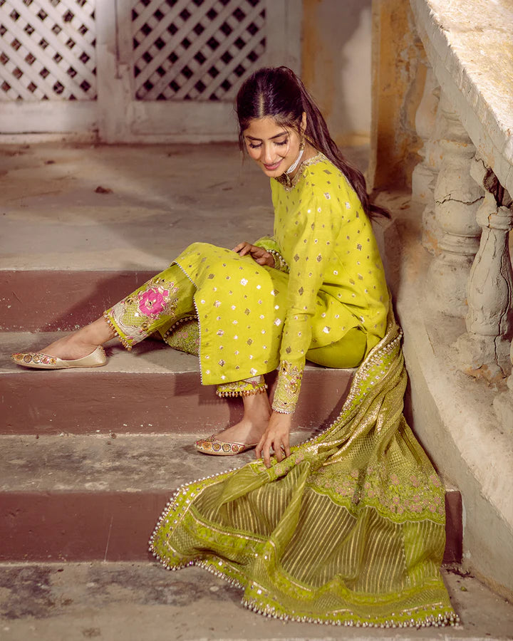 model wearing lime green dress by Faiza Saqlain, Pakistani luxury pret available online in UK for festive celebrations
