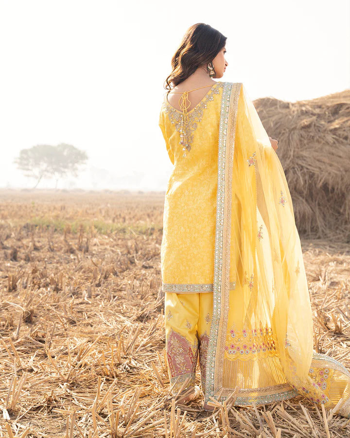 model wearing yellow dress by Faiza Saqlain, Pakistani luxury pret ideal for online shopping in the UK