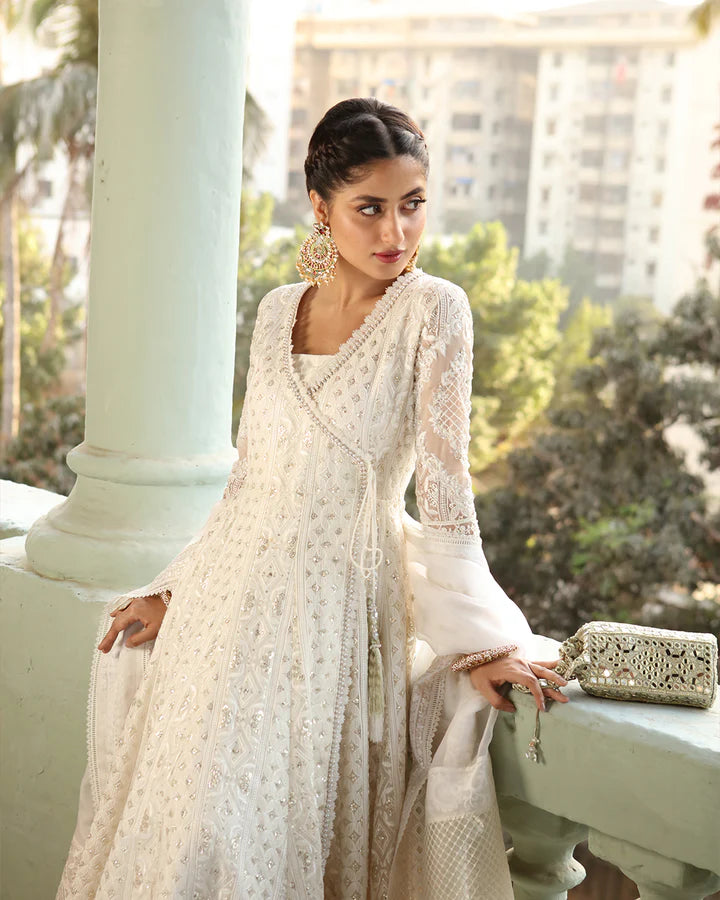 model wearing white dress with colorful dupatta by Faiza Saqlain, Pakistani luxury pret available online in UK