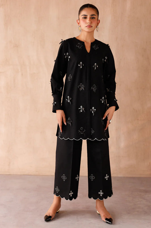 Model wearing black embroidered coords EP-07 Kaif from Qalamkar, a chic Pakistani luxury pret available online in UK.