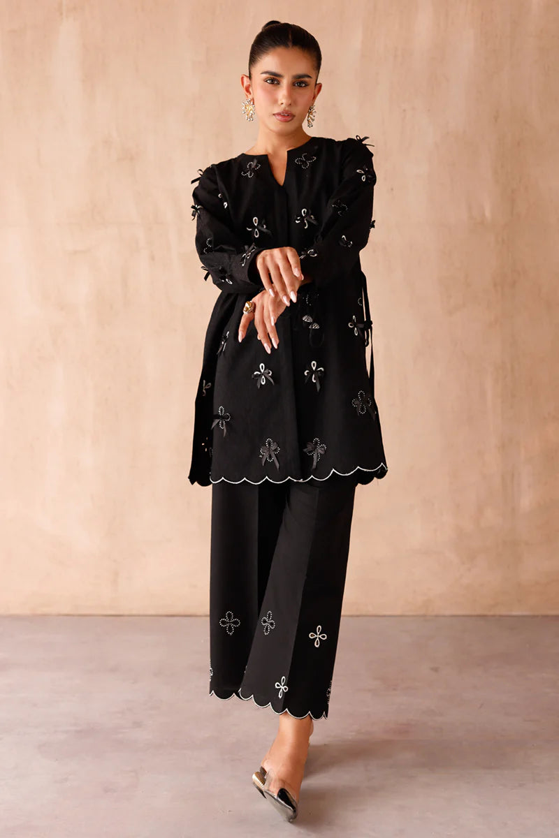 Model wearing black embroidered coords EP-07 Kaif from Qalamkar, a chic Pakistani luxury pret available online in UK.