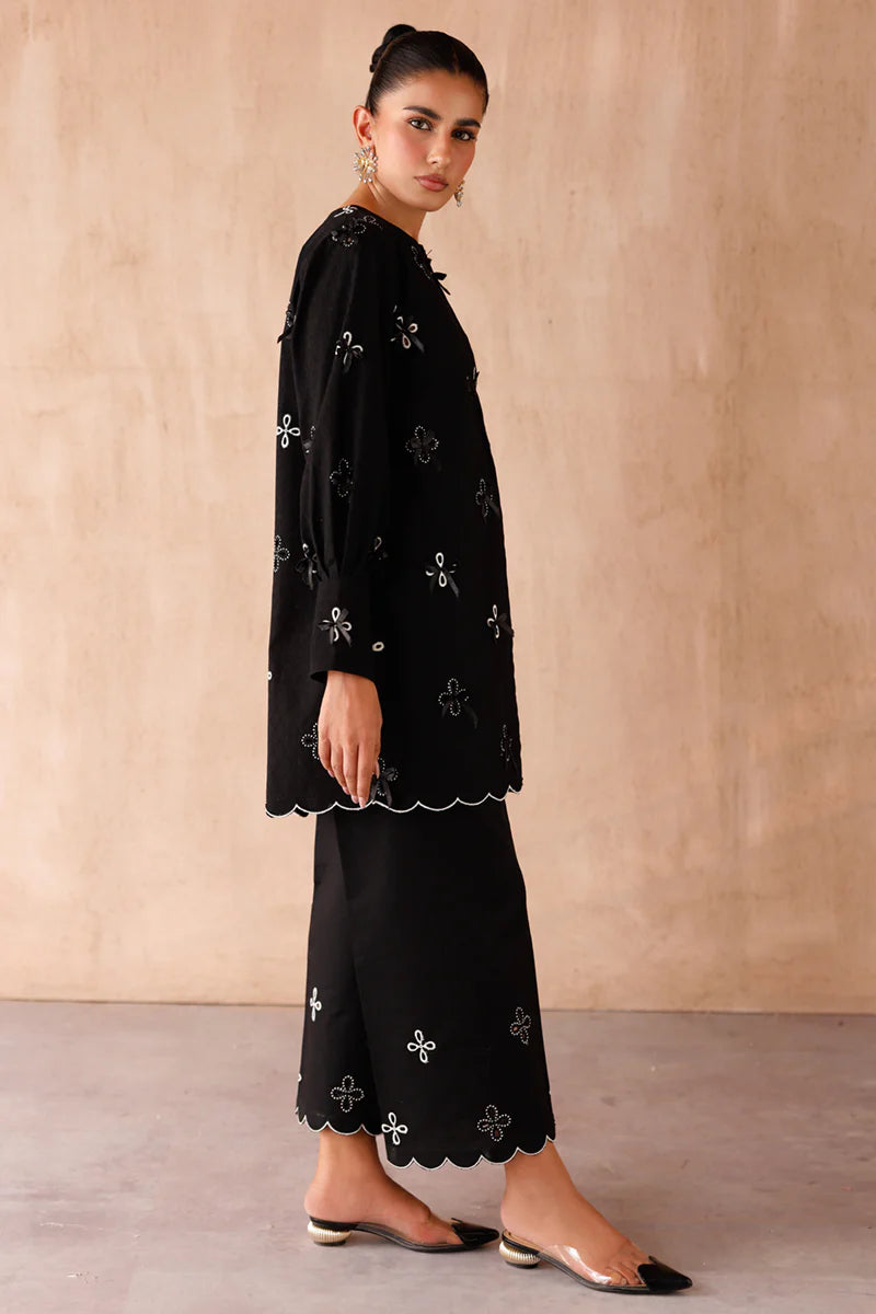 Model wearing black embroidered coords EP-07 Kaif from Qalamkar, a chic Pakistani luxury pret available online in UK.