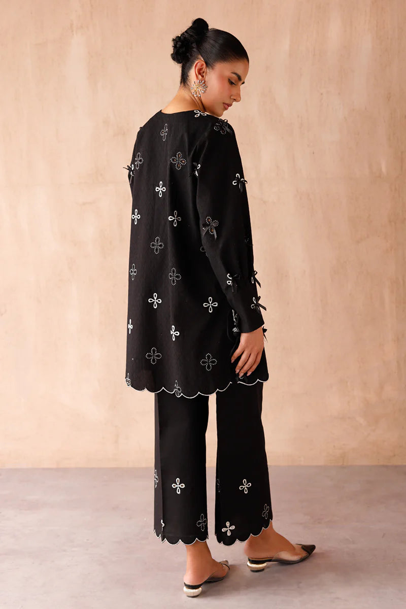 Model wearing black embroidered coords EP-07 Kaif from Qalamkar, a chic Pakistani luxury pret available online in UK.