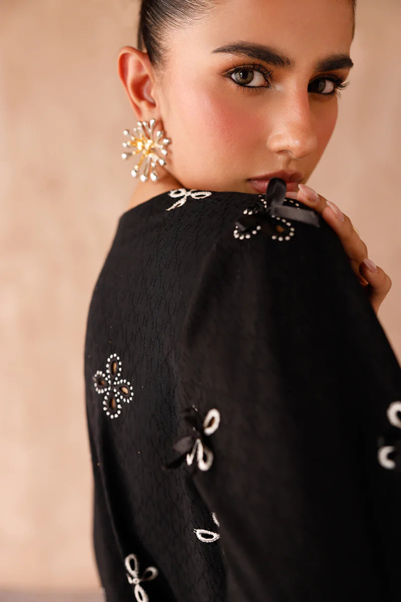 Model wearing black embroidered coords EP-07 Kaif from Qalamkar, a chic Pakistani luxury pret available online in UK.