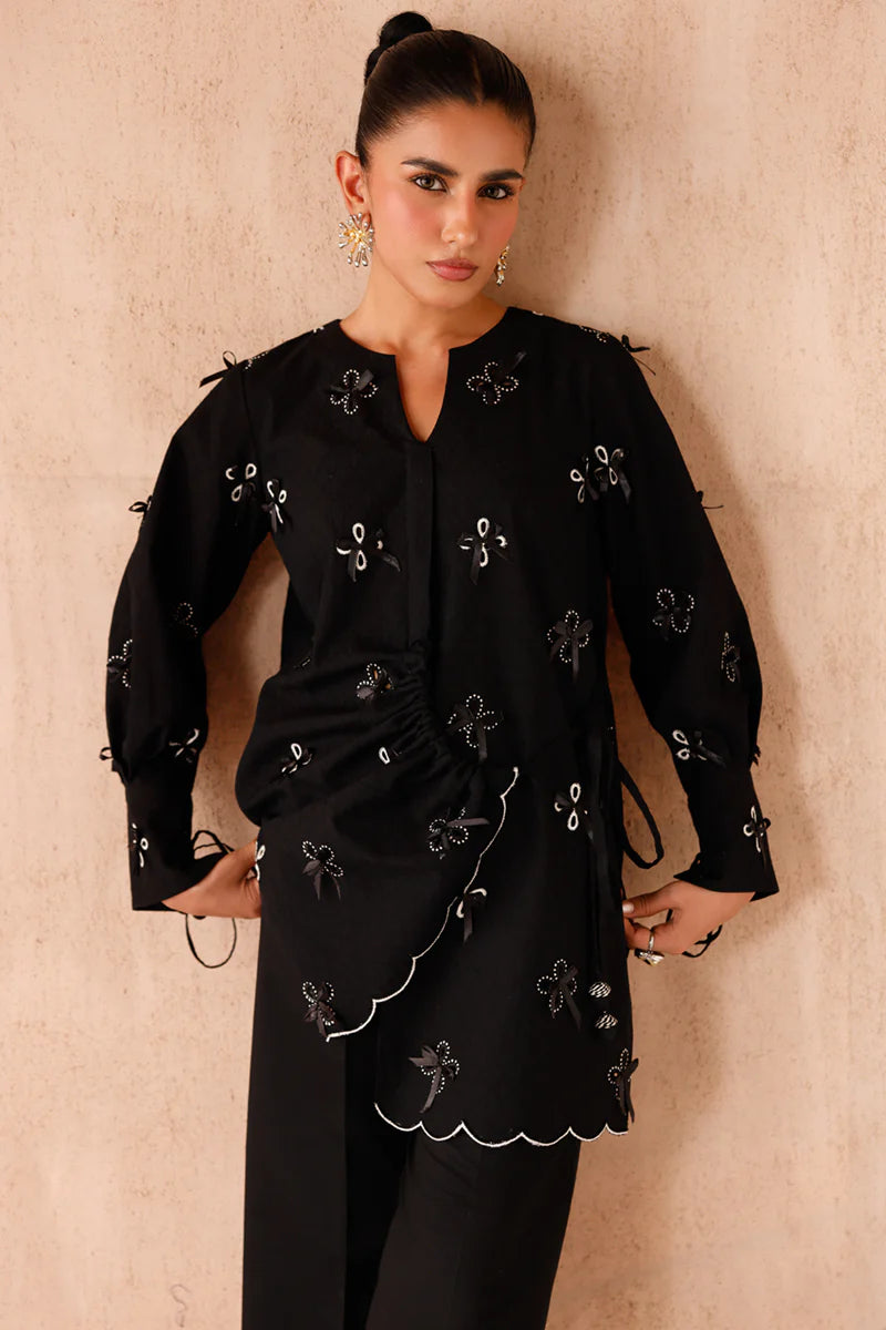 Model wearing black embroidered coords EP-07 Kaif from Qalamkar, a chic Pakistani luxury pret available online in UK.