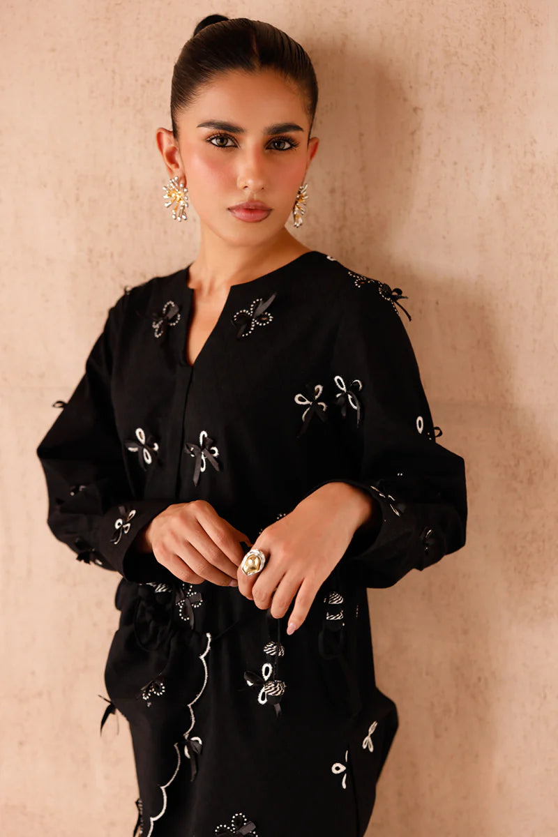 Model wearing black embroidered coords EP-07 Kaif from Qalamkar, a chic Pakistani luxury pret available online in UK.
