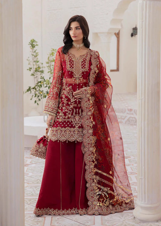 Model wearing deep red Zehrah outfit from Kanwal Malik with gold embroidery—Pakistani luxury pret perfect for weddings, shop in UK online.