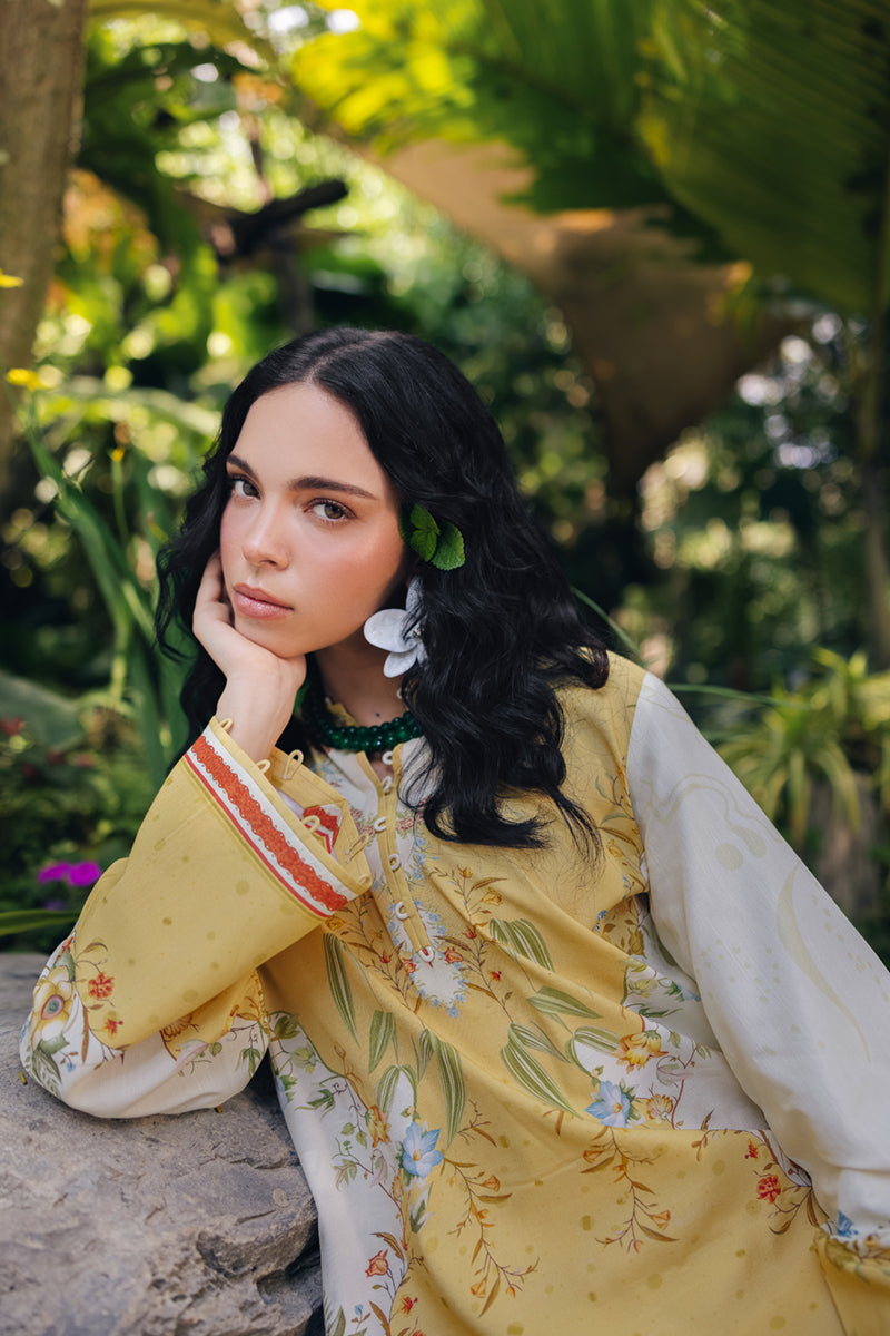 Model wearing OP-04 Tena, three-quarter view, a Pakistani designer outfit by Qalamkar, available online in the UK.