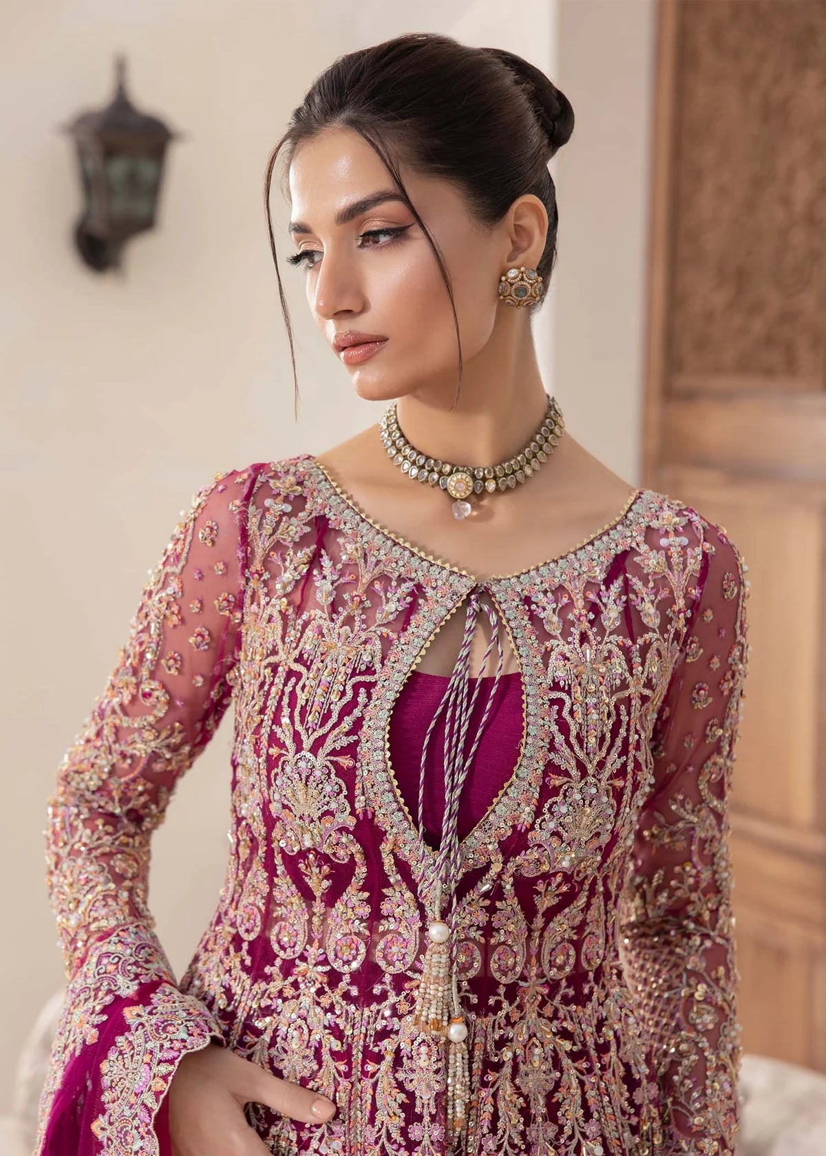 Model wearing deep magenta Kaira dress by Kanwal Malik, adorned with rich embroidery—Pakistani luxury pret available online in UK.