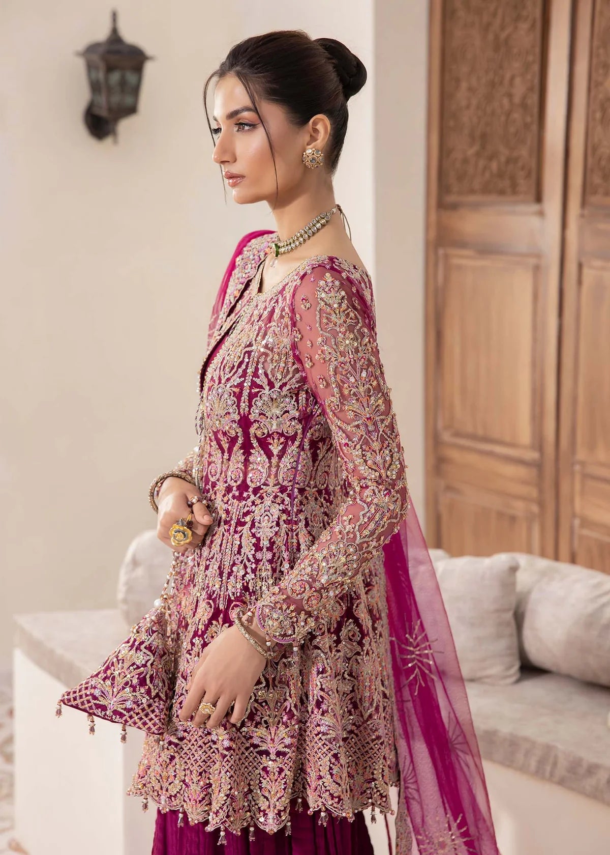 Model wearing deep magenta Kaira dress by Kanwal Malik, adorned with rich embroidery—Pakistani luxury pret available online in UK.