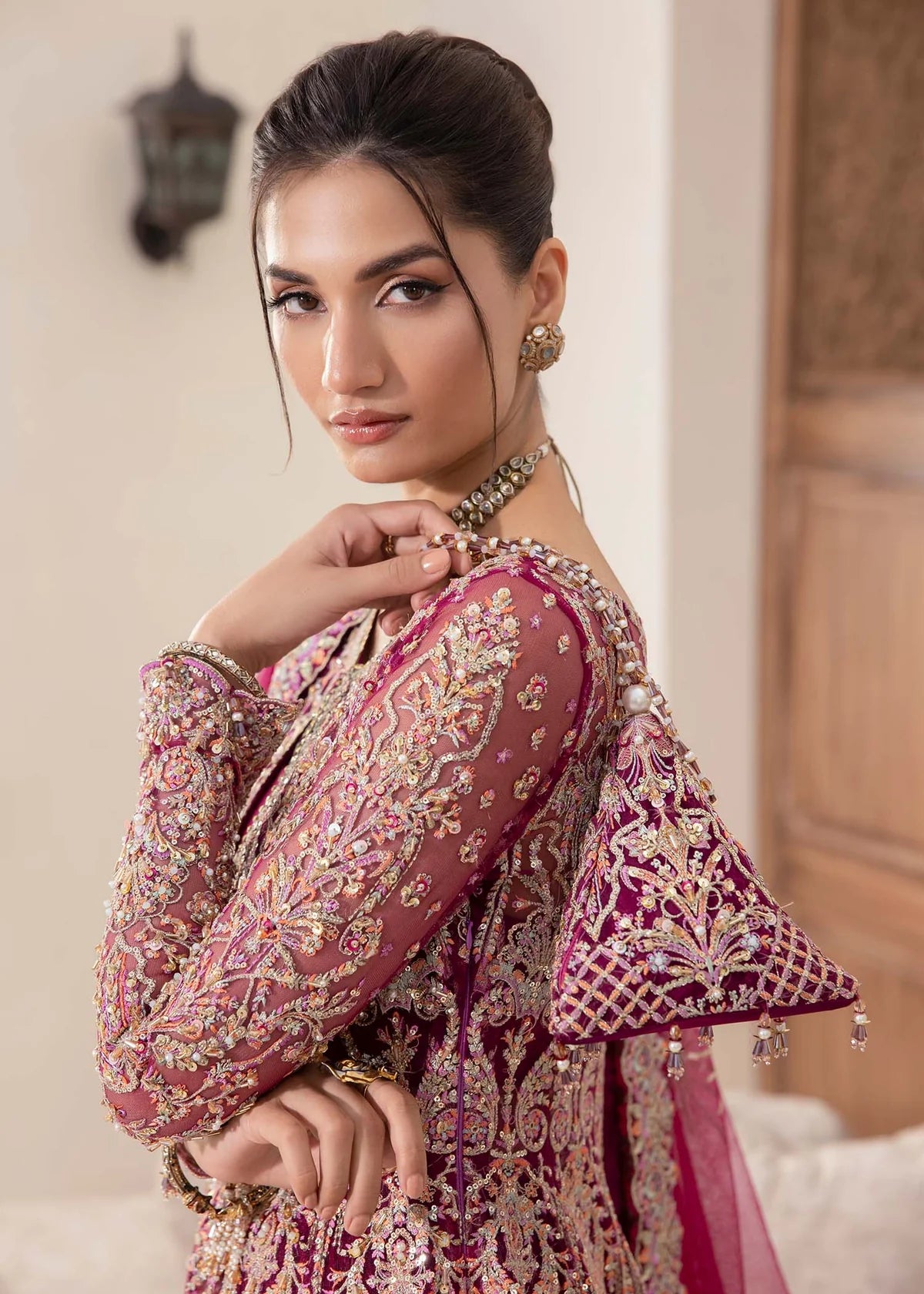 Model wearing deep magenta Kaira dress by Kanwal Malik, adorned with rich embroidery—Pakistani luxury pret available online in UK.