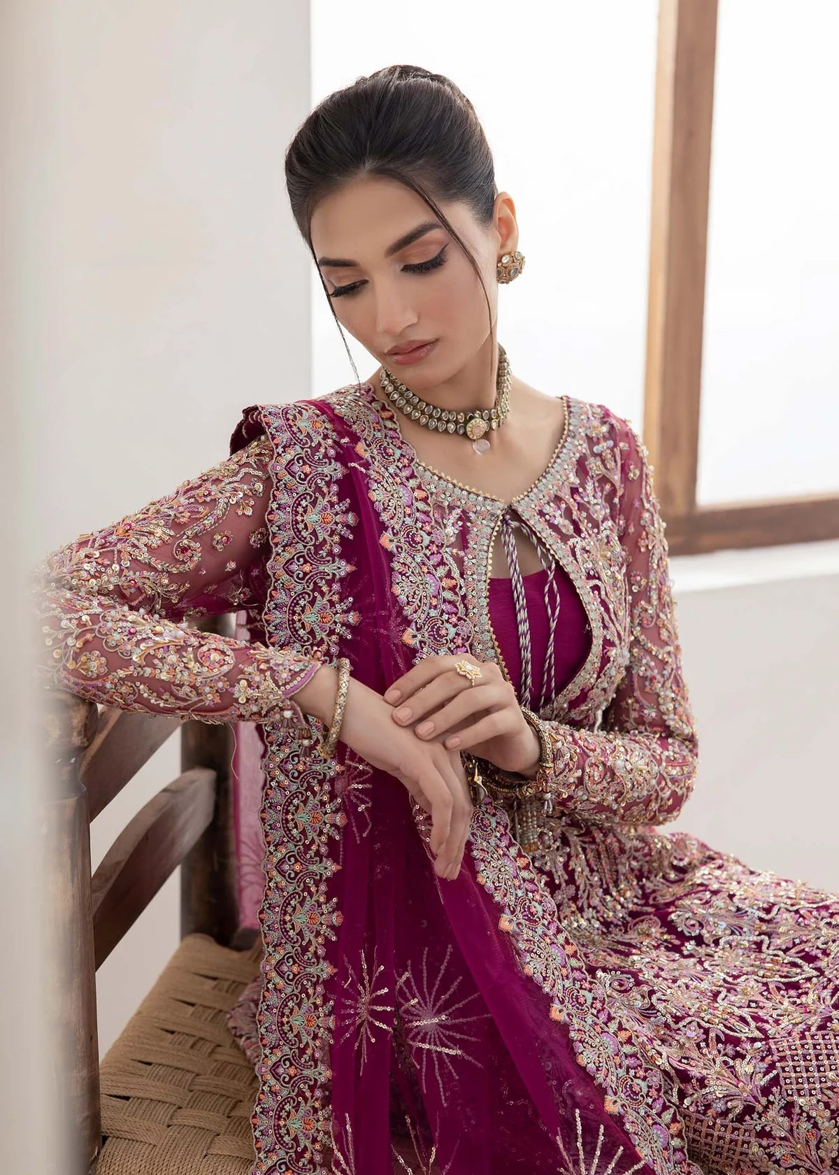 Model wearing deep magenta Kaira dress by Kanwal Malik, adorned with rich embroidery—Pakistani luxury pret available online in UK.