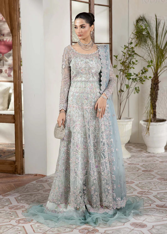 Model wearing powder blue Lily dress by Kanwal Malik, featuring intricate embroidery—Pakistani luxury pret available online in UK.
