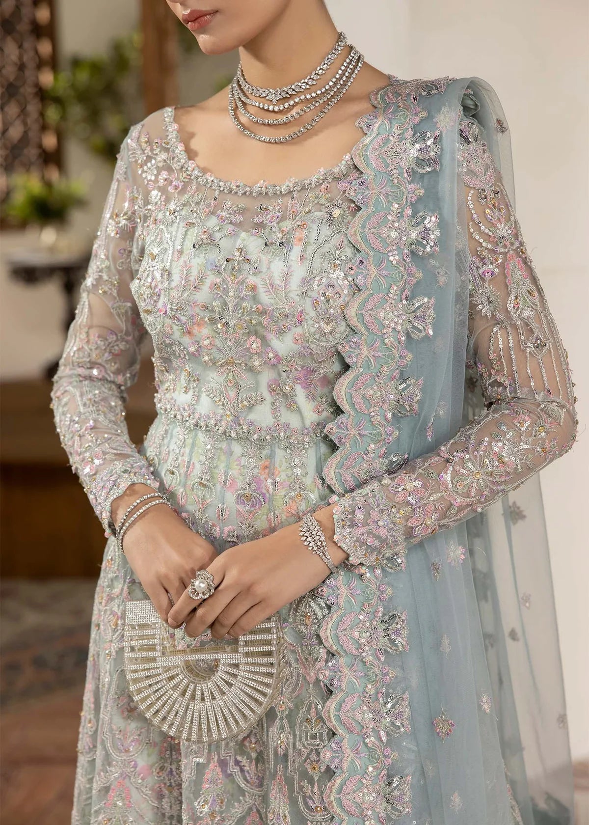 Model wearing powder blue Lily dress by Kanwal Malik, featuring intricate embroidery—Pakistani luxury pret available online in UK.