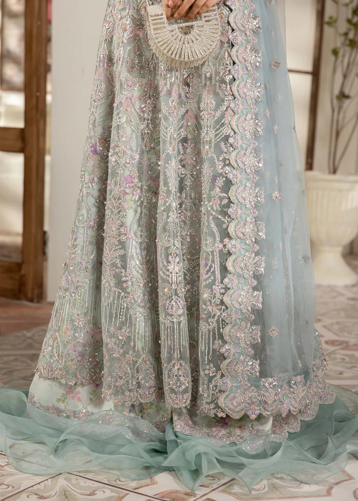 Model wearing powder blue Lily dress by Kanwal Malik, featuring intricate embroidery—Pakistani luxury pret available online in UK.