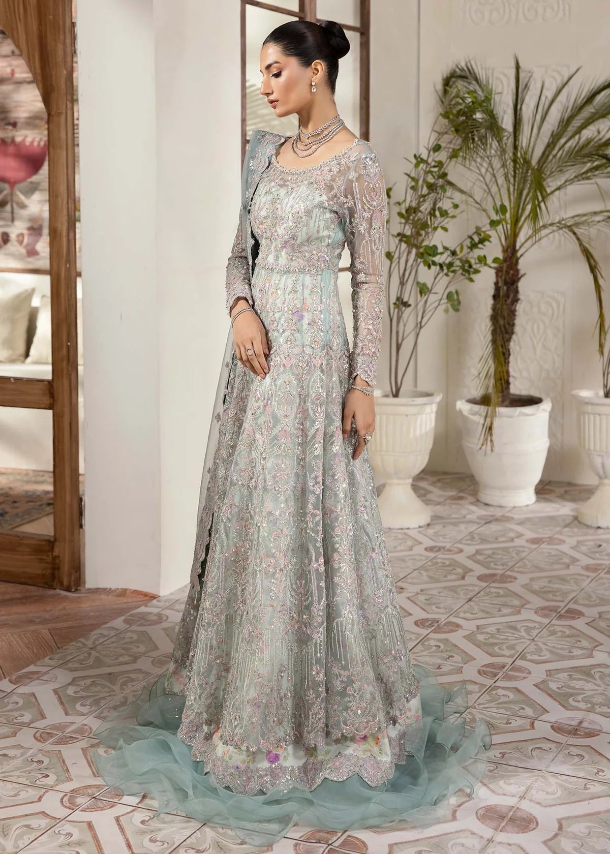 Model wearing powder blue Lily dress by Kanwal Malik, featuring intricate embroidery—Pakistani luxury pret available online in UK.