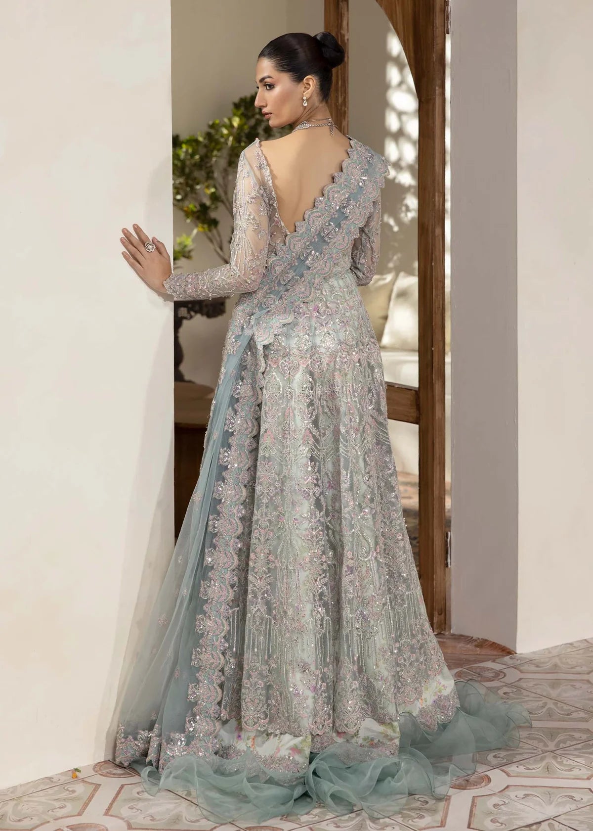 Model wearing powder blue Lily dress by Kanwal Malik, featuring intricate embroidery—Pakistani luxury pret available online in UK.