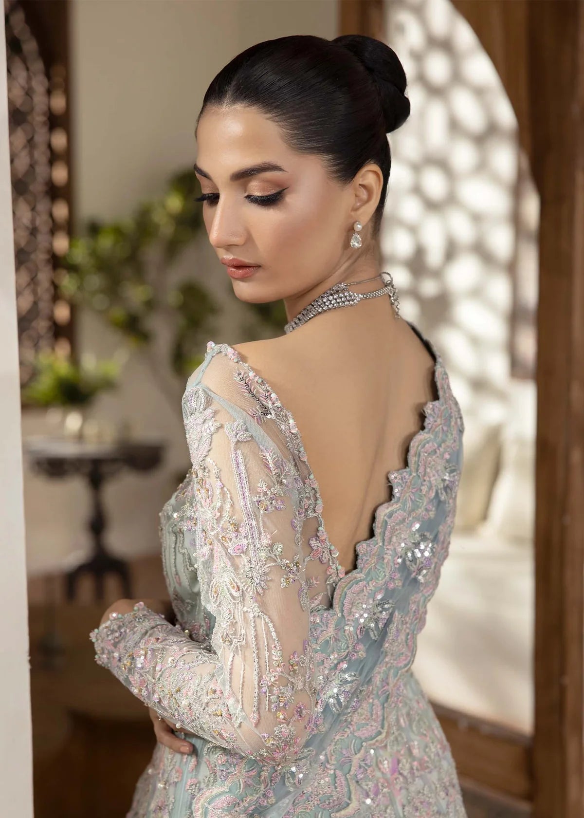 Model wearing powder blue Lily dress by Kanwal Malik, featuring intricate embroidery—Pakistani luxury pret available online in UK.
