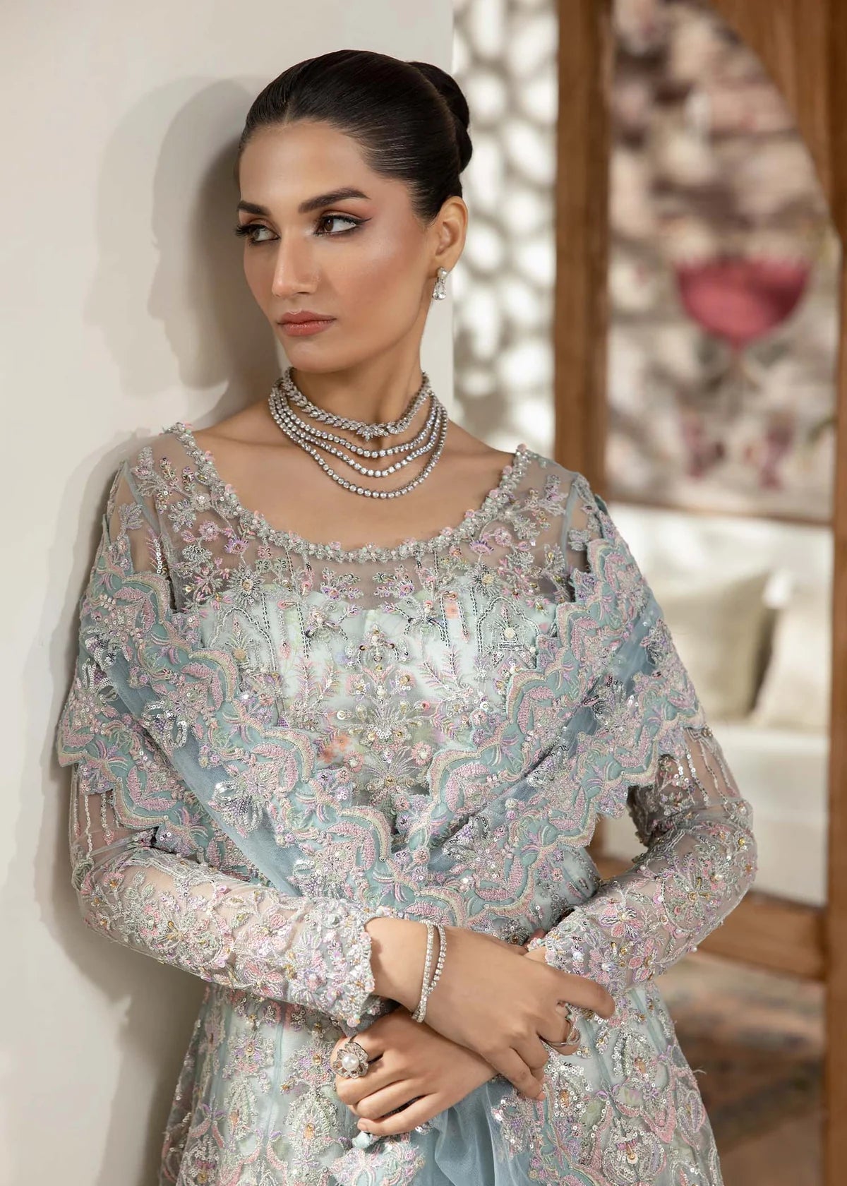 Model wearing powder blue Lily dress by Kanwal Malik, featuring intricate embroidery—Pakistani luxury pret available online in UK.